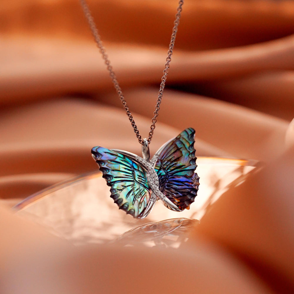 Hallmark Fine Jewelry Social Butterfly Pendant in Aurora Borealis Blue Carved Mother of Pearl and Sterling Silver with Diamonds